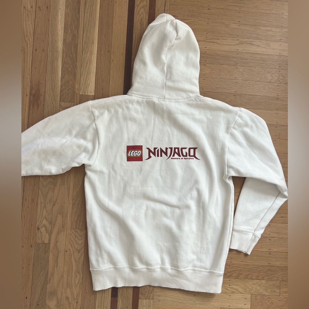 White hoodie with LEGO Ninjago text, size L